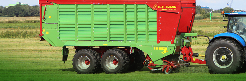 Close-up image of Strautmann Magnon 8 forage wagon lifting grass