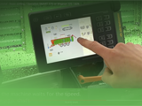 Image of operator using Smart 570 control panel on Strautmann Forage Wagon