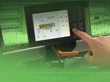 Image of operator setting the front panel of a Strautmann Forage Wagon using the Smart 570 control panel