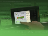 Image of operator using the automatic pick-up function on the Smart 570 control panel on a Strautmann Forage Wagon